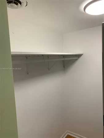 a bathroom with a sink a mirror and shower