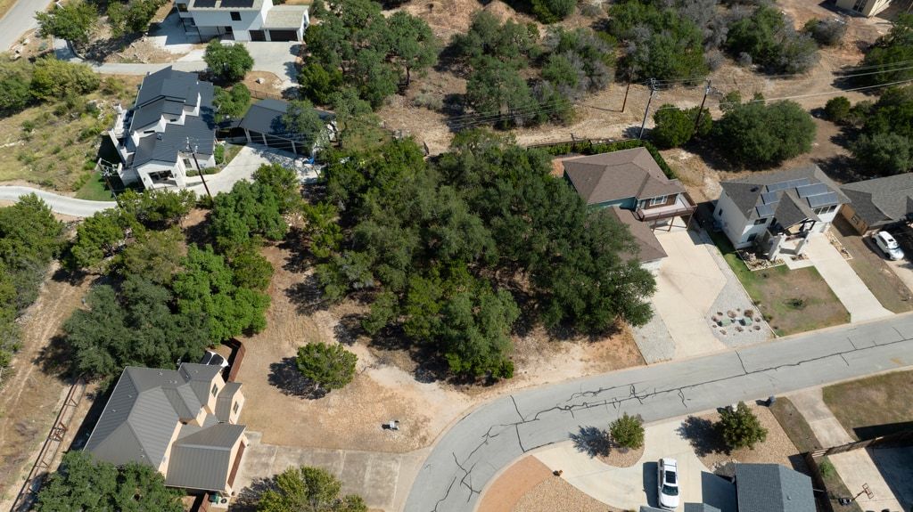 406 Summit Ridge Drive North Lago Vista, TX 78645 - Photo 16 of 25 an aerial view of a house with a yard