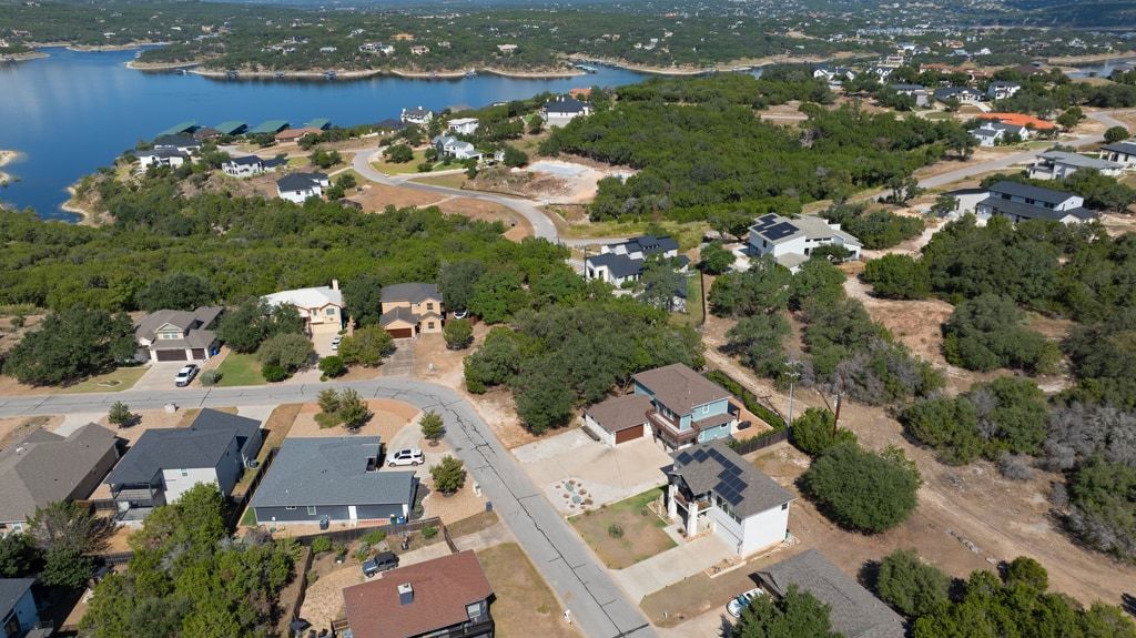 406 Summit Ridge Drive North Lago Vista, TX 78645 - Photo 19 of 25 an aerial view of residential house with outdoor space and lake view