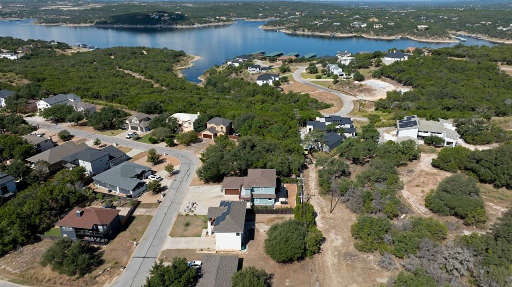 406 Summit Ridge Drive North Lago Vista, TX 78645 - Photo 20 of 25 an aerial view of a houses with yard