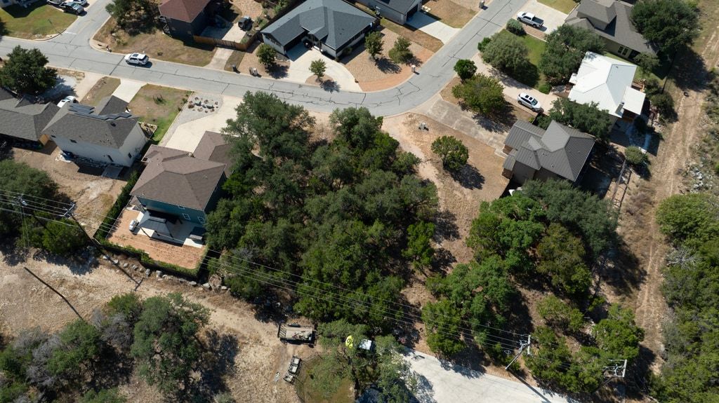 406 Summit Ridge Drive North Lago Vista, TX 78645 - Photo 22 of 25 an aerial view of a house with a yard