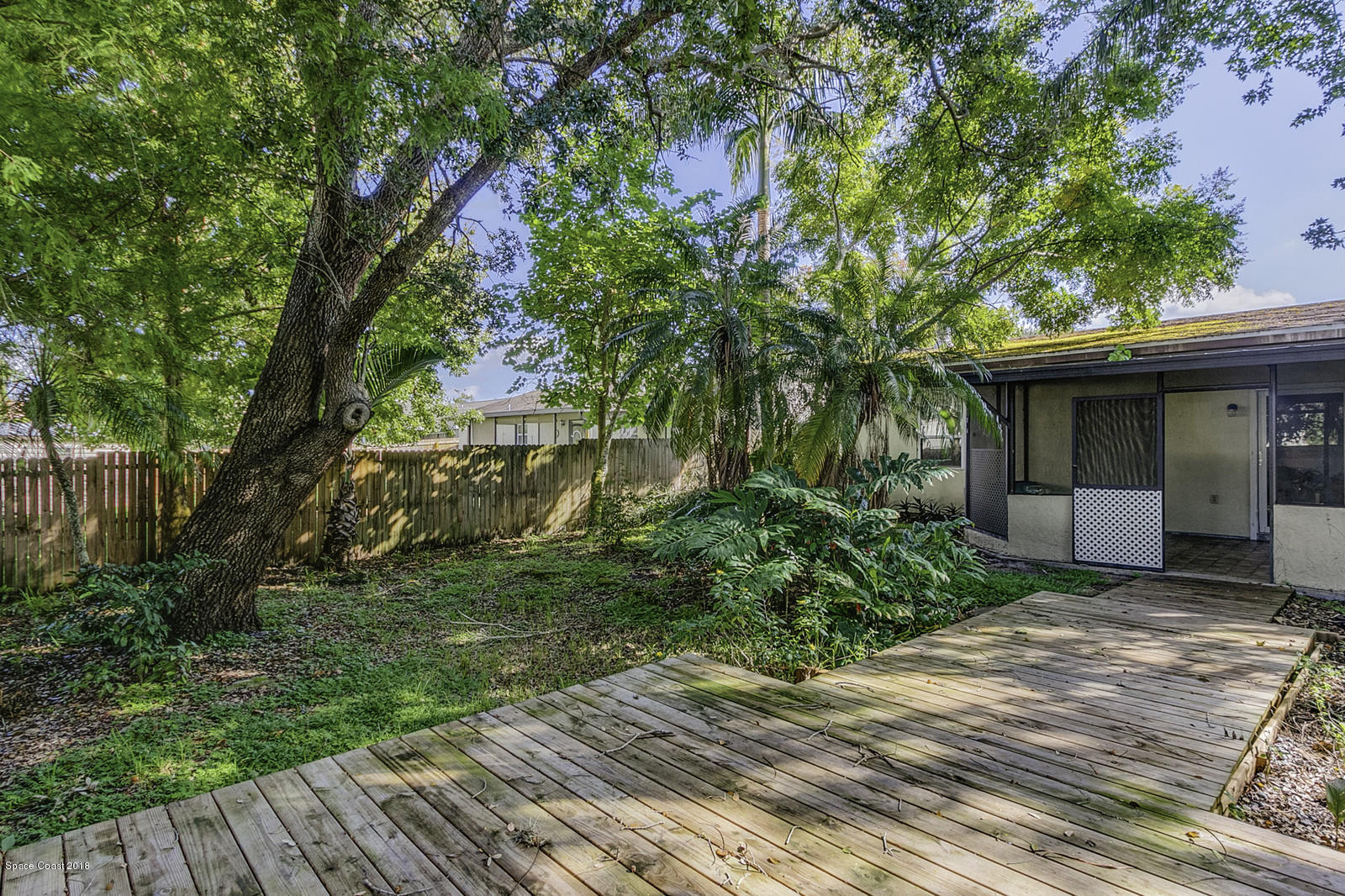 141 Virginia Road West Melbourne, FL 32904 - Photo 26 of 34 Wooden Deck and Walkway