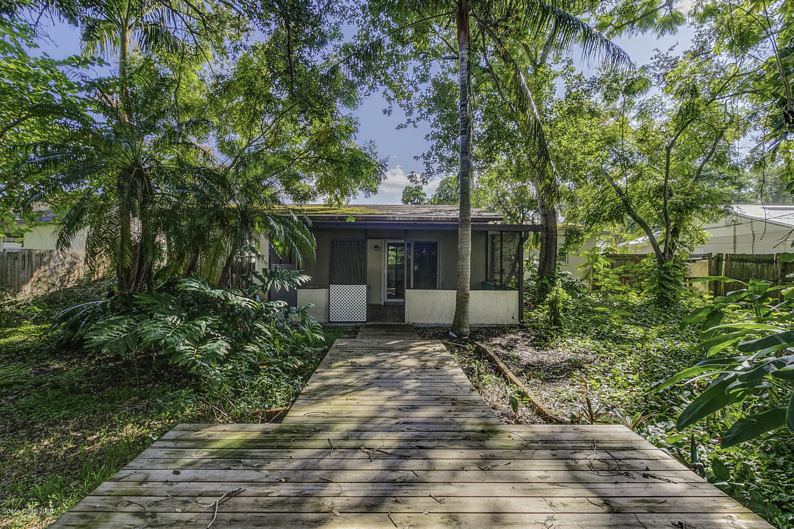 141 Virginia Road West Melbourne, FL 32904 - Photo 27 of 34 Wooden Deck and Walkway