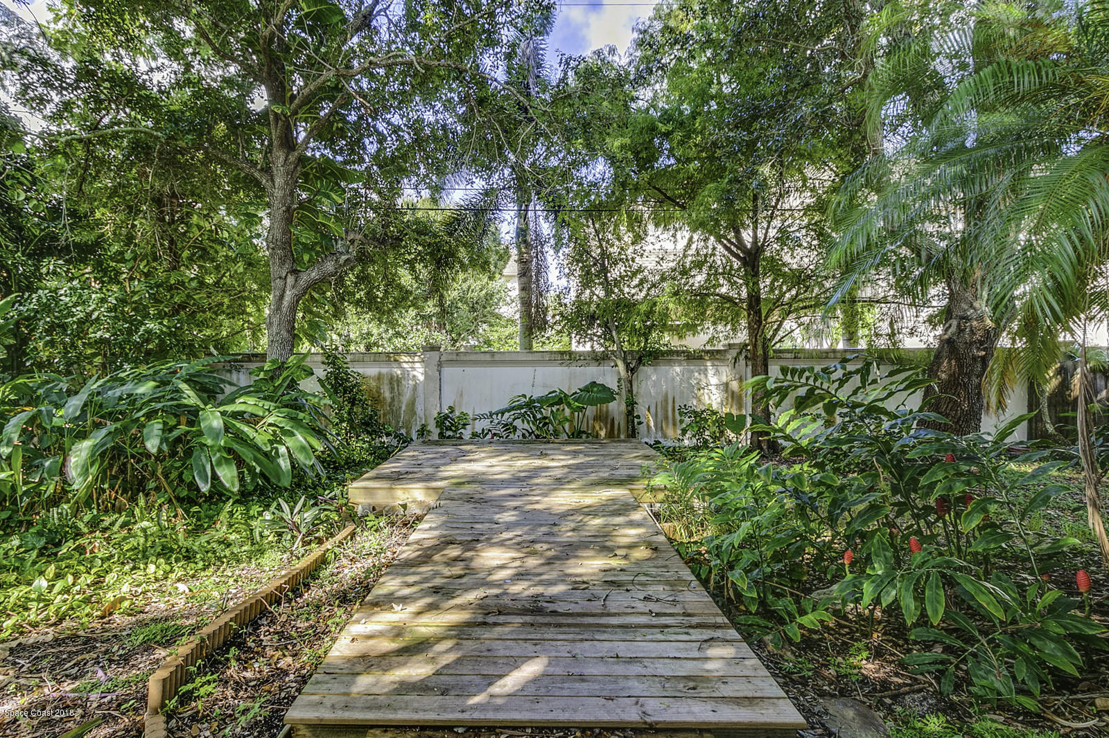 141 Virginia Road West Melbourne, FL 32904 - Photo 28 of 34 Wooden Deck and Walkway