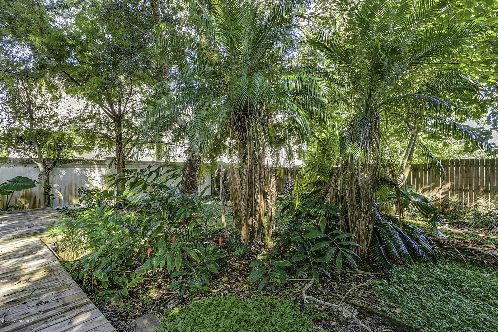 141 Virginia Road West Melbourne, FL 32904 - Photo 30 of 34 Wooden Deck and Walkway