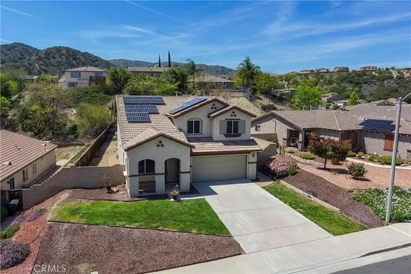 a aerial view of a house with a yard