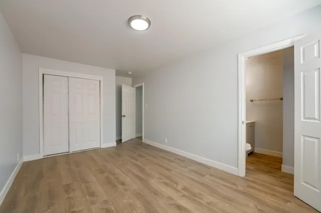 a kitchen with a white cabinets and white appliances