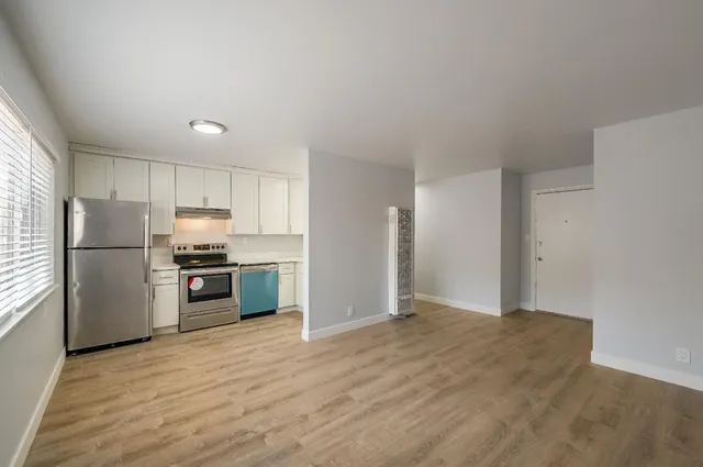 a view of a building with potted plants
