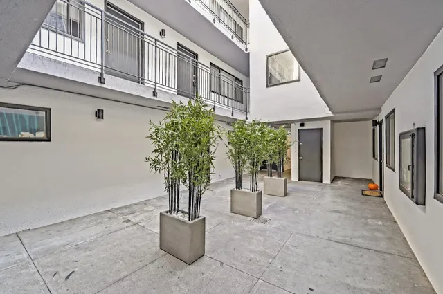 a kitchen with a refrigerator sink and stove
