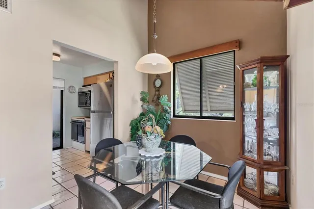 a dining room with furniture and window