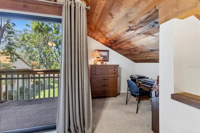 a view of a balcony with chairs