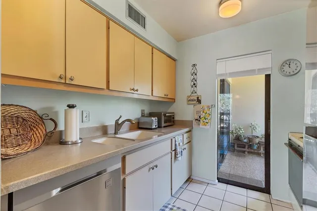 a kitchen with a sink and cabinets