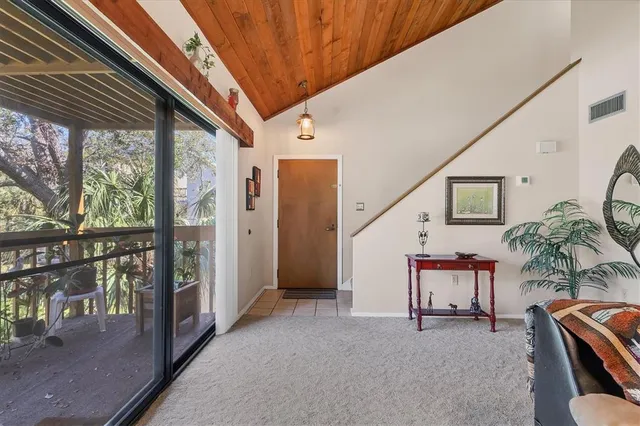 a view of work space with furniture and windows