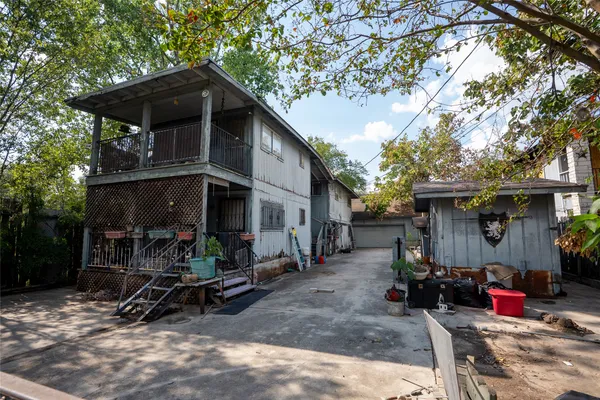 a view of a house with yard and sitting area