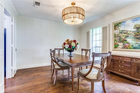 a dining room with furniture a livingroom and wooden floor