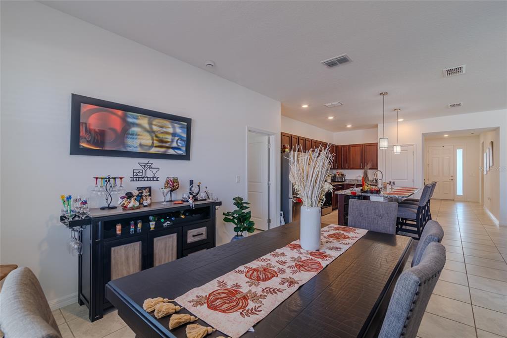 7095 Southwest 61st Place Ocala, FL 34474 - Photo 24 of 61 a living room with furniture and a flat screen tv