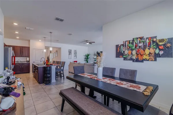 a spacious bathroom with a granite countertop sink and a mirror