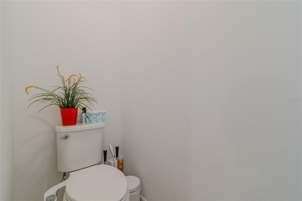 7095 Southwest 61st Place Ocala, FL 34474 - Photo 34 of 61 a bathroom with a toilet and a sink