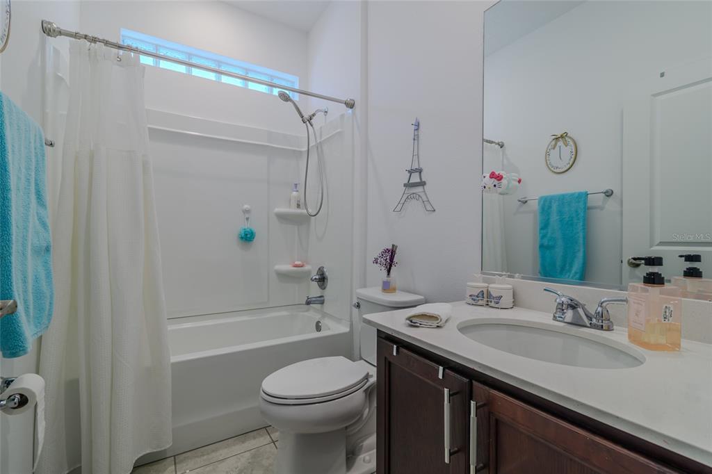 7095 Southwest 61st Place Ocala, FL 34474 - Photo 36 of 61 a bathroom with a sink a toilet and shower