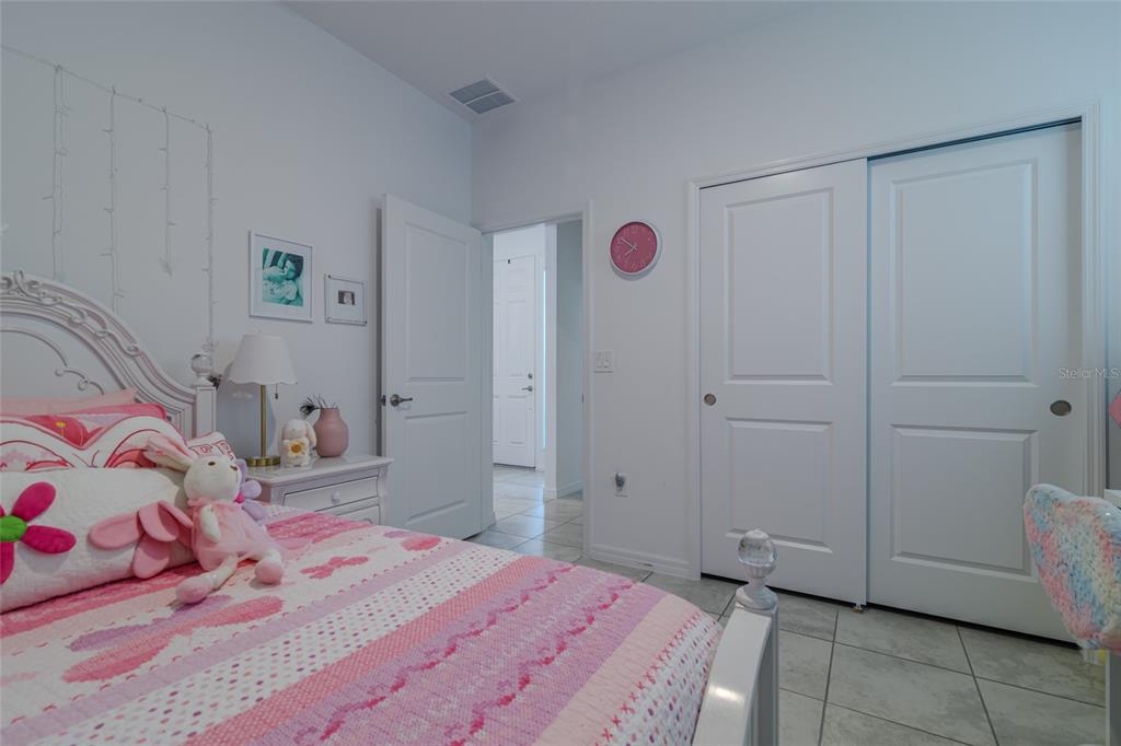 7095 Southwest 61st Place Ocala, FL 34474 - Photo 38 of 61 a bedroom with a bed and a cabinets