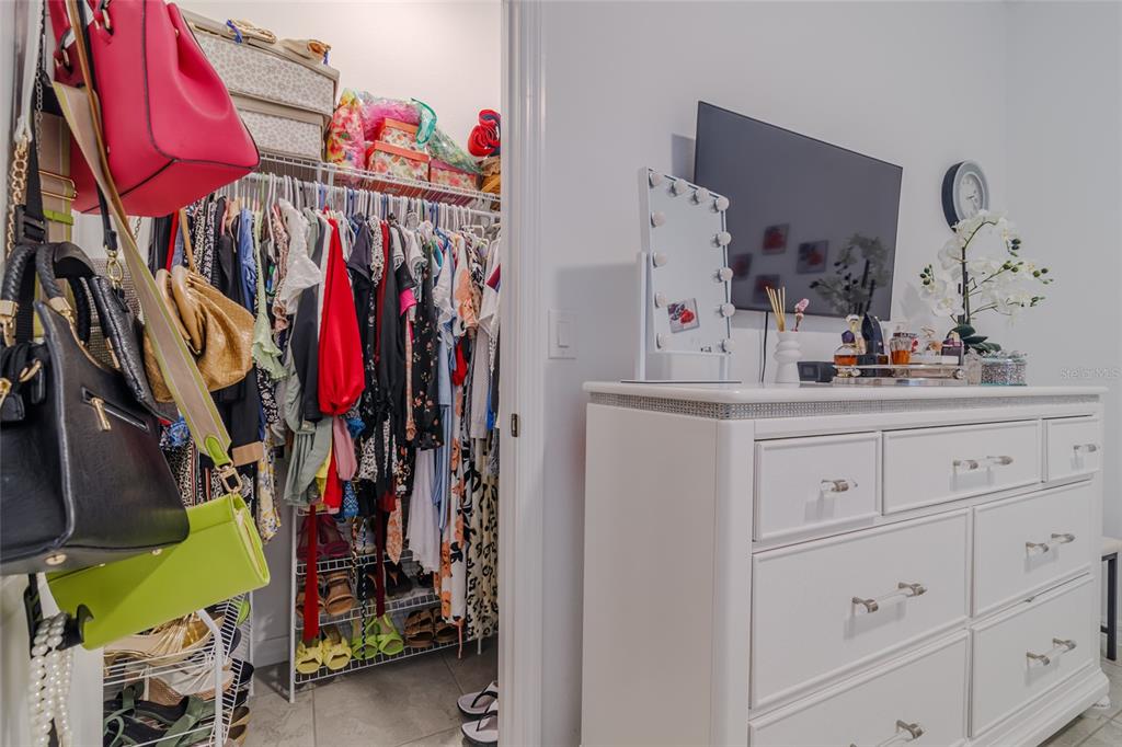 7095 Southwest 61st Place Ocala, FL 34474 - Photo 43 of 61 a view of walk in closet with clothes