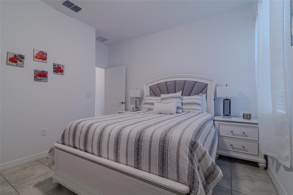 7095 Southwest 61st Place Ocala, FL 34474 - Photo 44 of 61 a bedroom with a bed and a cabinets