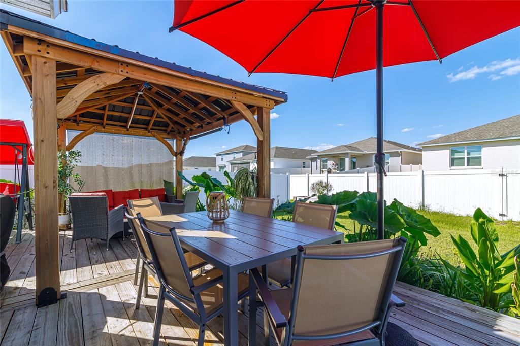 7095 Southwest 61st Place Ocala, FL 34474 - Photo 53 of 61 a view of a backyard with a patio and outdoor seating