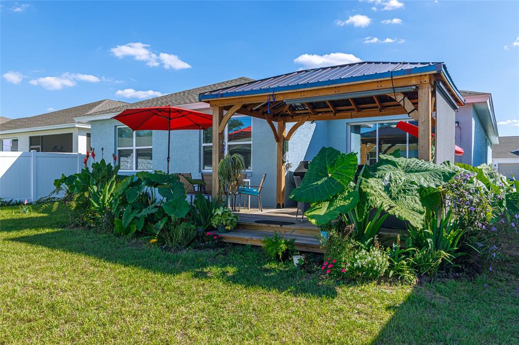 7095 Southwest 61st Place Ocala, FL 34474 - Photo 56 of 61 a front view of house with yard and outdoor seating