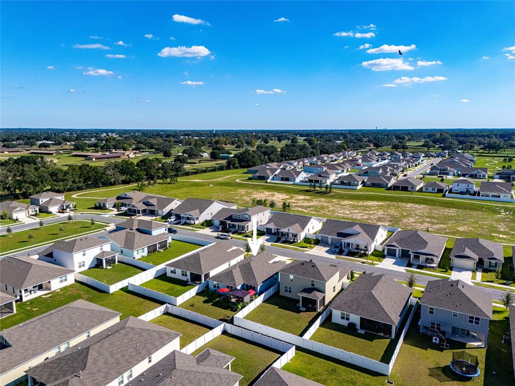 7095 Southwest 61st Place Ocala, FL 34474 - Photo 7 of 61 a view of swimming pool with outdoor seating a yard and ocean view