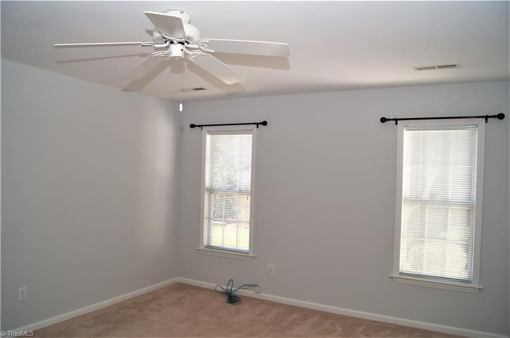 4320 Riverside Drive Clemmons, NC 27012 - Photo 12 of 20 Master bedroom with ensuite & walk-in closet