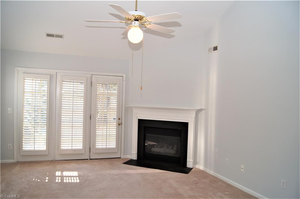 4320 Riverside Drive Clemmons, NC 27012 - Photo 10 of 20 Den with gas fireplace & French doors to patio