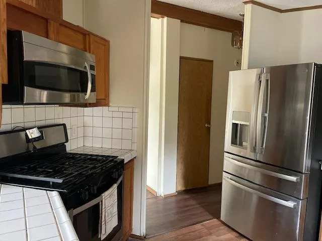 a view of a room with furniture and window