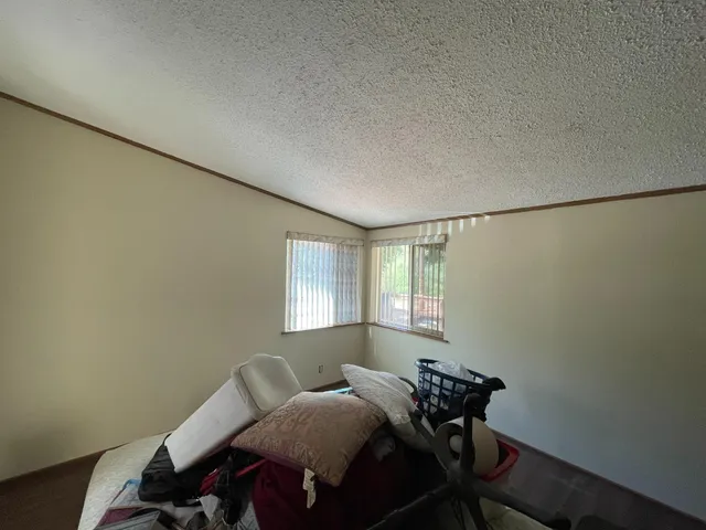 a kitchen with a sink a window and cabinets