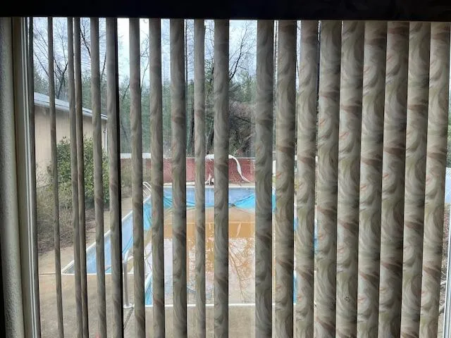 a kitchen with granite countertop a sink stove and cabinets