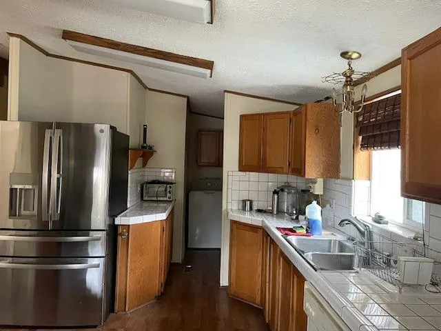 a kitchen with a stove and a microwave