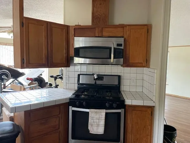 a kitchen with a refrigerator and a sink