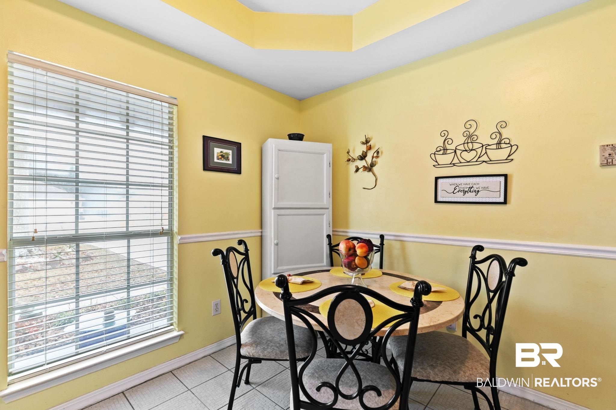 519 Juniper Place Drive Foley, AL 36535 - Photo 19 of 47 Dining space featuring a raised ceiling and light tile patterned floors