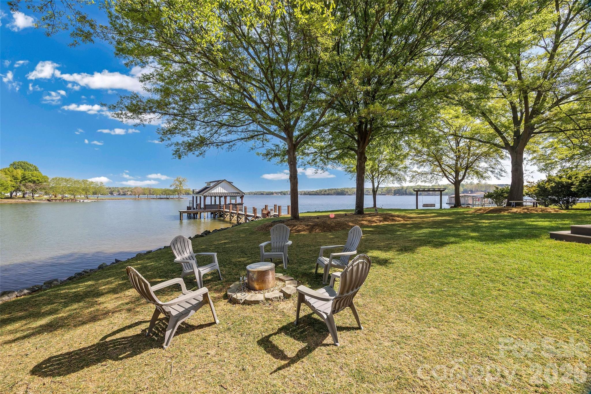 5280 Masons Ferry Road Clover, SC 29710 - Photo 39 of 45 a view of a lake with table and chairs