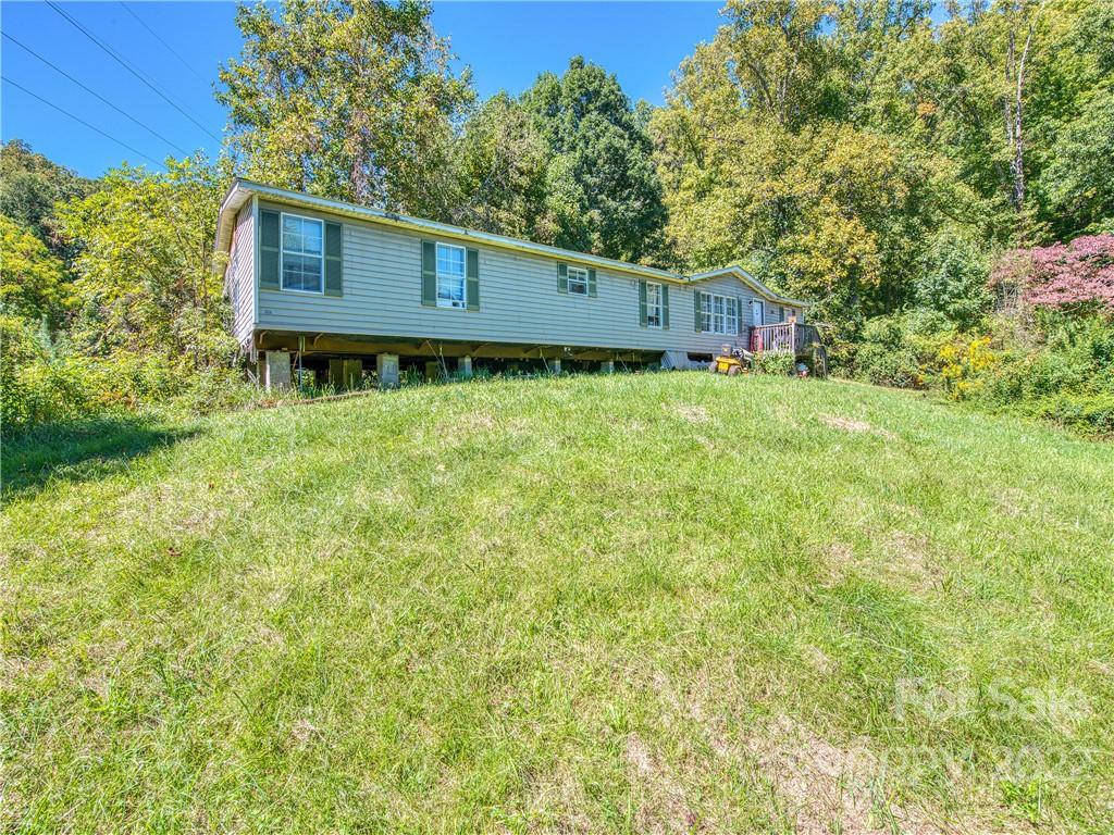 124 Oconeechee Road Clyde, NC 28721 - Photo 3 of 14 a house view with a backyard space