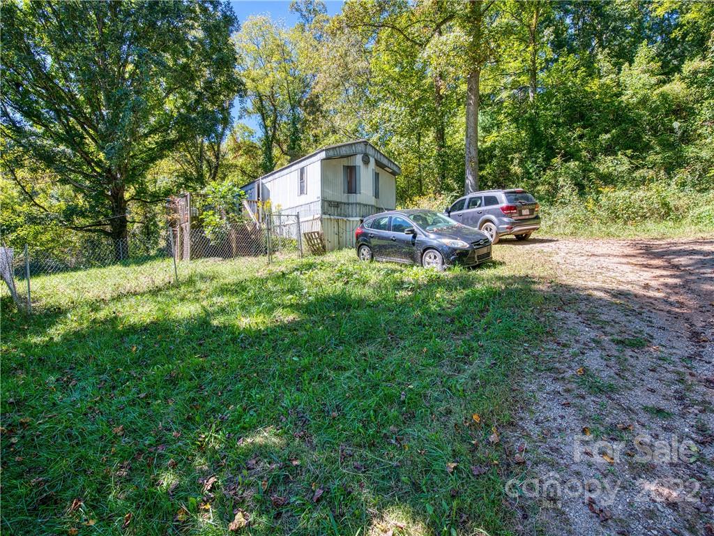 124 Oconeechee Road Clyde, NC 28721 - Photo 4 of 14 a house view with a backyard space