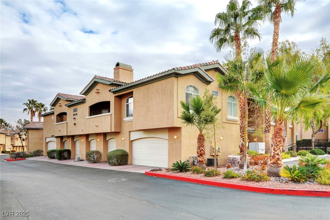 View of property featuring an attached garage