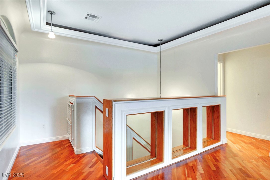 8725 Red Rio Drive, Unit 203 Las Vegas, NV 89128 - Photo 2 of 38 Hall with wood finished floors and baseboards