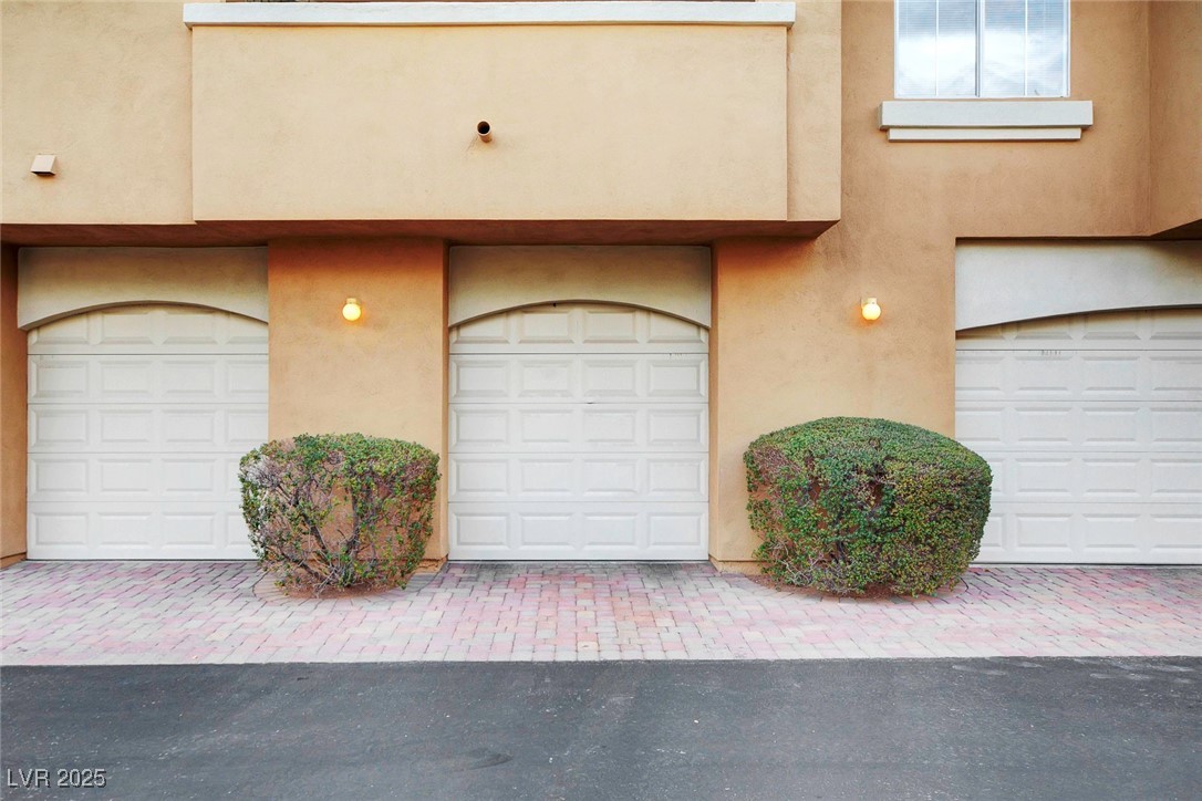 8725 Red Rio Drive, Unit 203 Las Vegas, NV 89128 - Photo 33 of 38 View of exterior entry with stucco siding