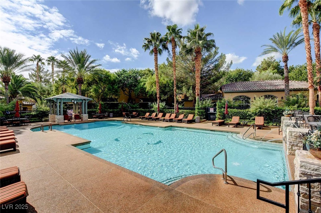 8725 Red Rio Drive, Unit 203 Las Vegas, NV 89128 - Photo 37 of 38 Community pool with a gazebo and a patio
