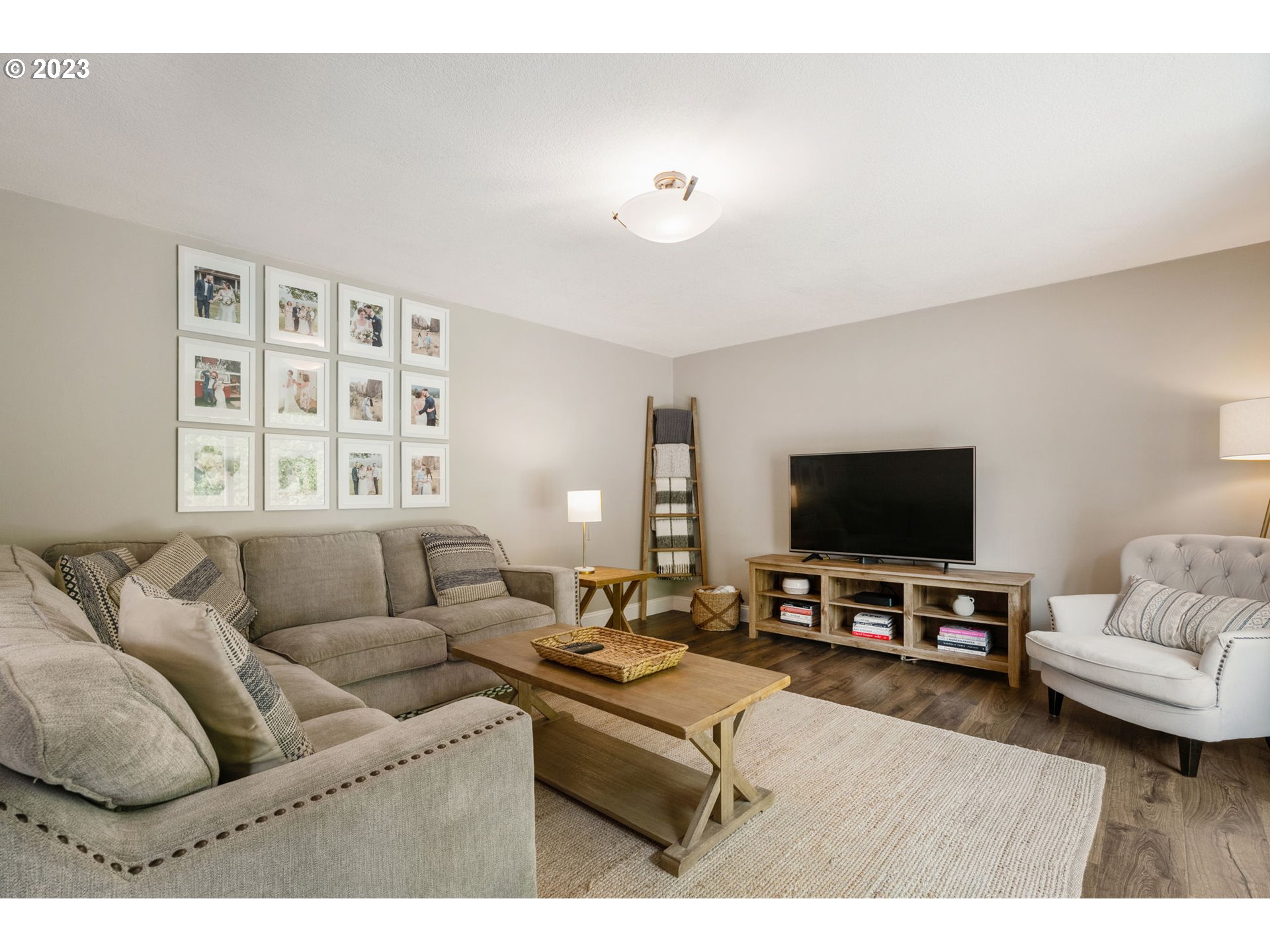 326 Southeast 236th Court Gresham, OR 97030 - Photo 11 of 34 a living room with furniture and a flat screen tv