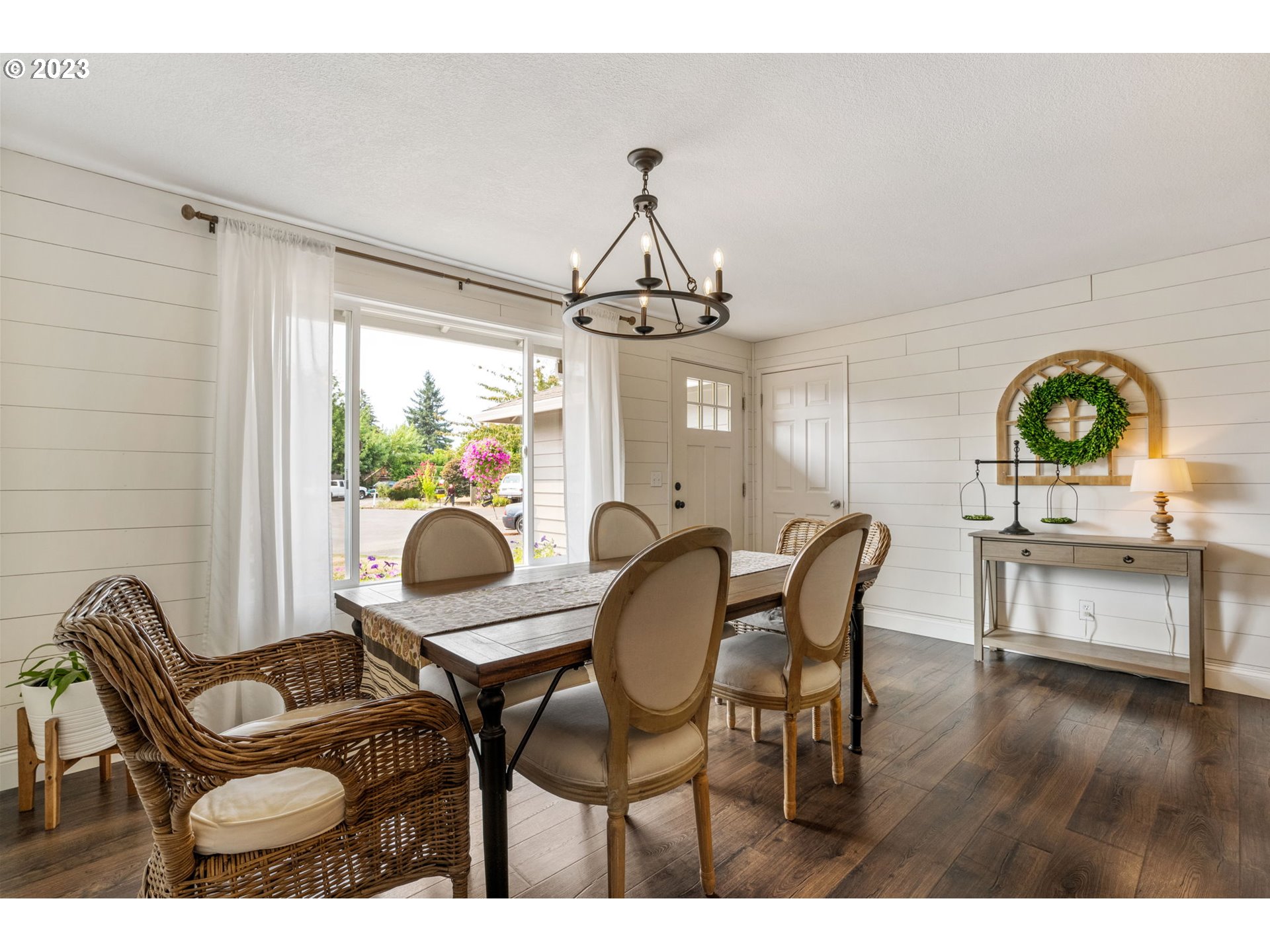 326 Southeast 236th Court Gresham, OR 97030 - Photo 16 of 34 a dining room with furniture a chandelier and wooden floor