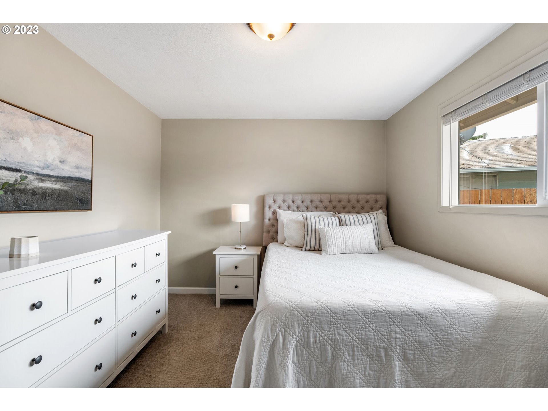 326 Southeast 236th Court Gresham, OR 97030 - Photo 17 of 34 a bedroom with bed and a flat tv screen on the dresser