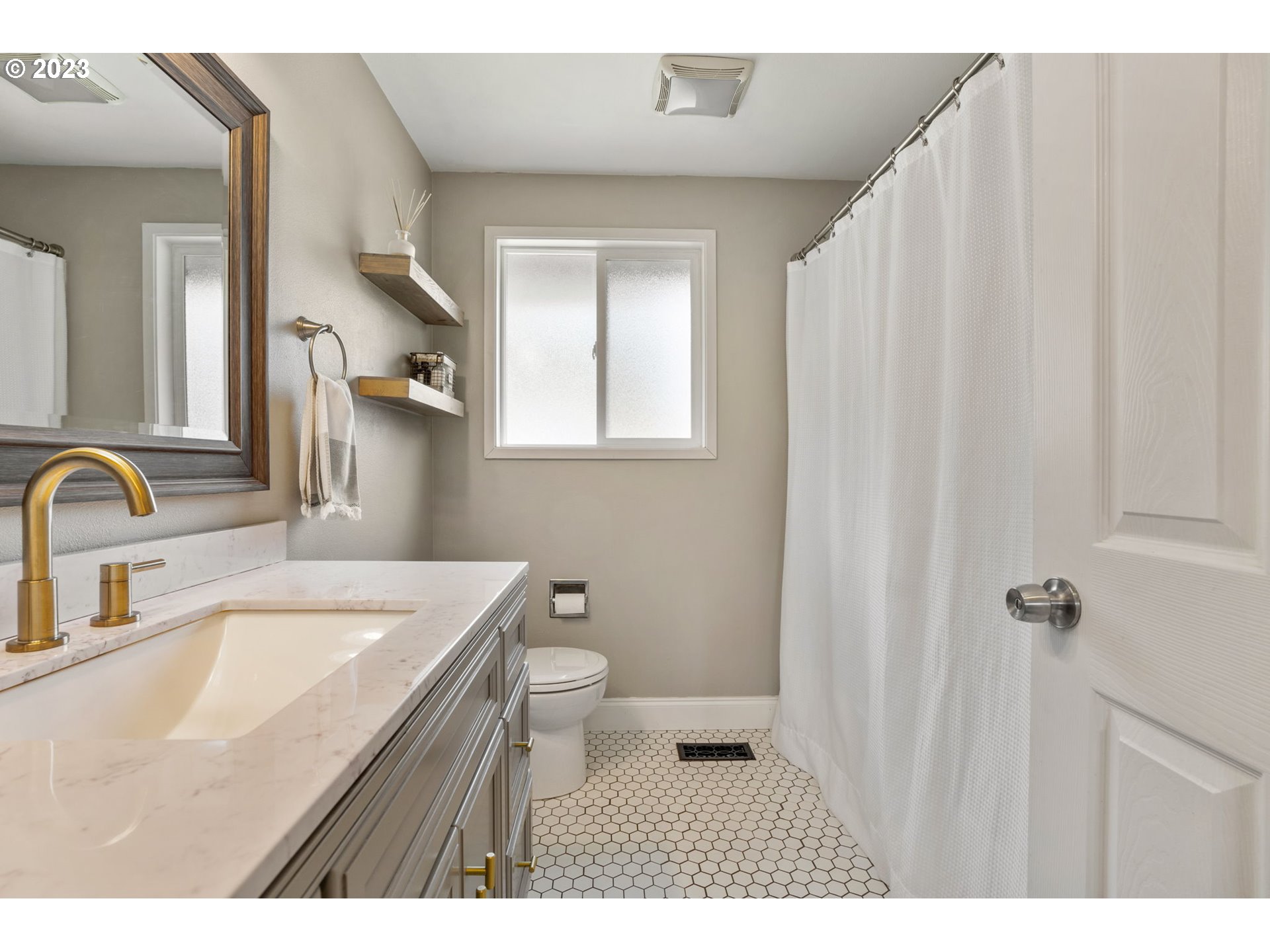 326 Southeast 236th Court Gresham, OR 97030 - Photo 19 of 34 a bathroom with a sink a toilet and a mirror