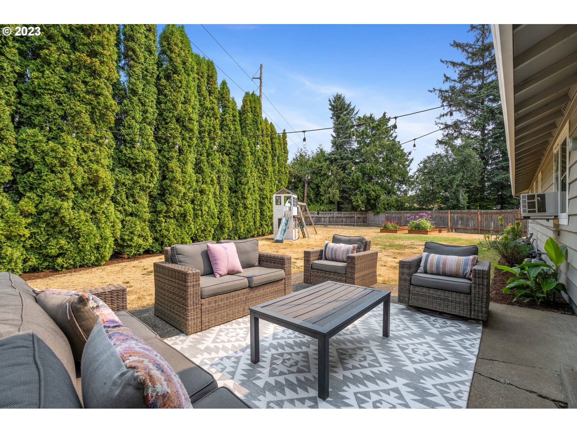 326 Southeast 236th Court Gresham, OR 97030 - Photo 27 of 34 a outdoor living room with furniture and a potted plant