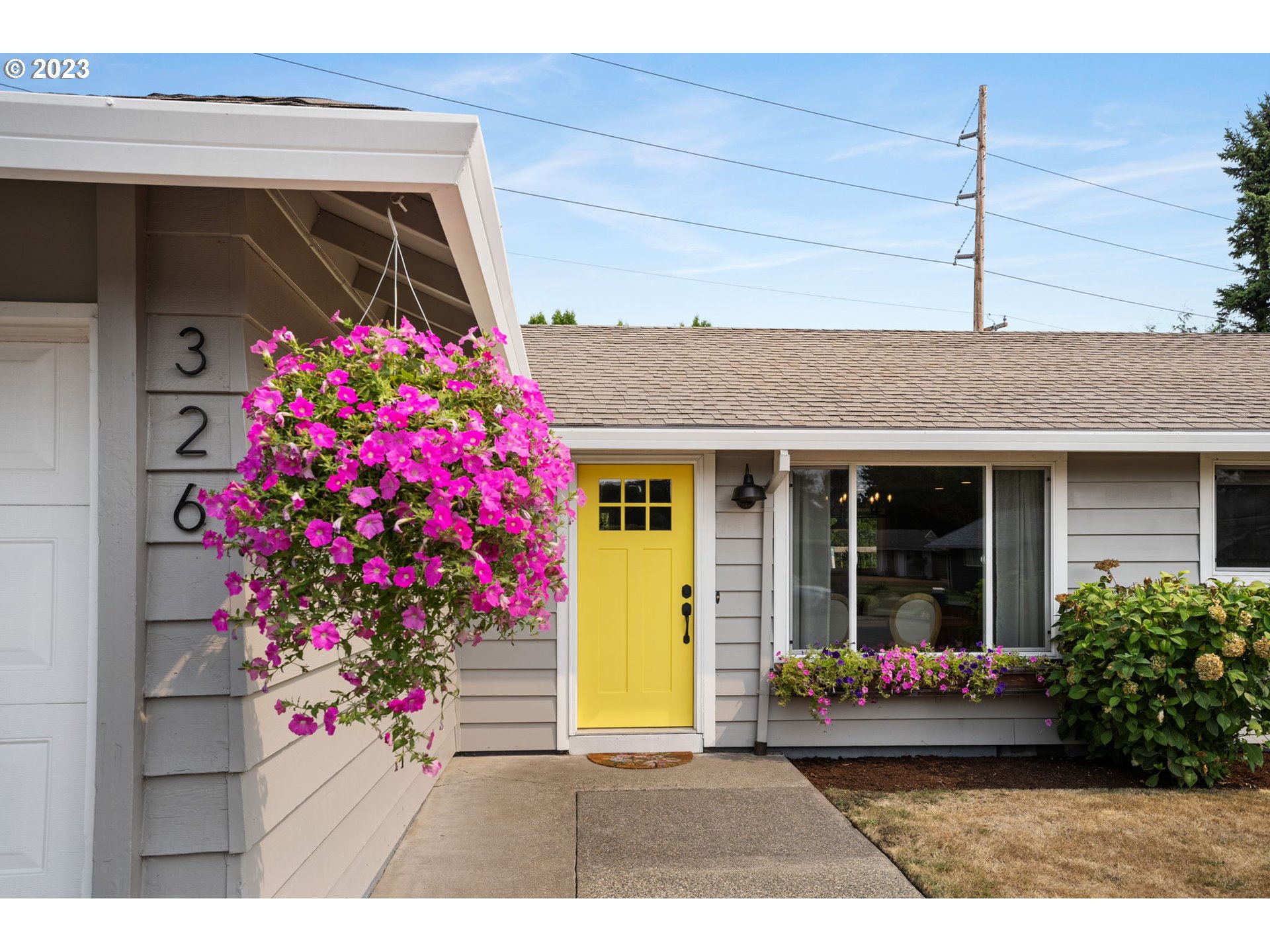 326 Southeast 236th Court Gresham, OR 97030 - Photo 3 of 34 a view of a porch with flowers